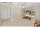The room features tile floors, a ceiling fan, and a picturesque window view at 1305 Santa Maria Ave, The Villages, FL 32159