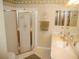Well-lit bathroom featuring a step-in shower, neutral-toned walls, and coordinated decor at 1310 Jimenez Ct, The Villages, FL 32159