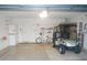 Well-organized garage featuring ample storage space, bicycle, and a golf cart at 1310 Jimenez Ct, The Villages, FL 32159