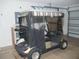 Tan Yamaha golf cart featuring an enclosure, striped canopy, and chrome rims at 1310 Jimenez Ct, The Villages, FL 32159