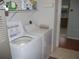 Bright laundry room with a washing machine and a dryer in a storage room at 1310 Jimenez Ct, The Villages, FL 32159