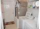 Bright laundry room with a washing machine and a dryer in a storage room at 1310 Jimenez Ct, The Villages, FL 32159