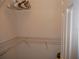 Organized walk-in closet with extensive shelving, ideal for maximizing storage space at 1310 Jimenez Ct, The Villages, FL 32159