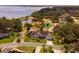 A scenic aerial view of a charming home in a lush community with lake access at 1350 Mosswood Dr, Leesburg, FL 34748