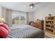 Bedroom featuring neutral colors, a ceiling fan and natural light at 1350 Mosswood Dr, Leesburg, FL 34748