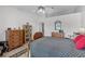 Bright bedroom with vaulted ceiling with a ceiling fan and spacious closets at 1350 Mosswood Dr, Leesburg, FL 34748