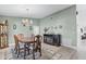 Classic dining room showcasing a chandelier, dining set with seating, display cabinet and stylish decor accents at 1350 Mosswood Dr, Leesburg, FL 34748