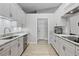 Modern kitchen featuring sleek countertops, stainless steel appliances, and ample storage space with white cabinets at 1350 Mosswood Dr, Leesburg, FL 34748
