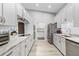 Bright kitchen features stainless steel appliances, ample counter space, and modern cabinetry for stylish meal preparation at 1350 Mosswood Dr, Leesburg, FL 34748