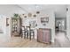Cozy living area with bar seating, a view into the kitchen, and stylish decor throughout the adjacent space at 1350 Mosswood Dr, Leesburg, FL 34748