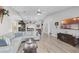 Open living space with a view of the kitchen and high ceilings at 1350 Mosswood Dr, Leesburg, FL 34748