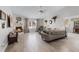 Spacious living room boasts a cozy fireplace, plush seating, and abundant natural light filtering through large windows at 1350 Mosswood Dr, Leesburg, FL 34748