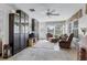 Spacious living room with ample seating, natural light, built-in storage, and access to the outdoors at 1350 Mosswood Dr, Leesburg, FL 34748