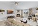 Bright living room features a fireplace, neutral colors, and stylish furnishings at 1350 Mosswood Dr, Leesburg, FL 34748