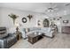 Spacious living room has tile floors and leads to the kitchen at 1350 Mosswood Dr, Leesburg, FL 34748