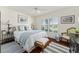 Cozy bedroom with bright natural light, hardwood floors and relaxing decor at 1446 Arbor Trl, The Villages, FL 32162