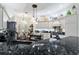 A kitchen featuring granite countertops, stainless steel appliances, and ample cabinet space at 1446 Arbor Trl, The Villages, FL 32162