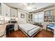 Office featuring a Murphy bed, built-in shelving, hardwood flooring, and natural light at 1446 Arbor Trl, The Villages, FL 32162