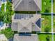 Aerial view of a single-Gathering home featuring solar panels on the roof and well-maintained landscaping at 15322 Veramonte Way, Orlando, FL 32828