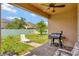 The home's backyard has a patio, a grill, green grass, and a partial fence at 15322 Veramonte Way, Orlando, FL 32828