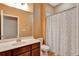 Well-lit bathroom features a shower and a sink at 15322 Veramonte Way, Orlando, FL 32828