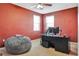 The bedroom features an ample space with a bean bag, carpet floors, and a black computer desk at 15322 Veramonte Way, Orlando, FL 32828