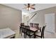 Inviting dining room features a ceiling fan and a wooden table with six matching chairs at 15322 Veramonte Way, Orlando, FL 32828