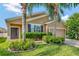 Lovely single-story home with meticulously landscaped yard, beautiful palm trees, and brick driveway for added charm at 15322 Veramonte Way, Orlando, FL 32828