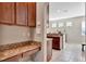 Convenient desk area with granite countertop beside the kitchen at 15322 Veramonte Way, Orlando, FL 32828