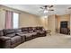 This living room has a large sofa with cup holders at 15322 Veramonte Way, Orlando, FL 32828