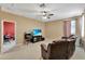 Welcoming living room is perfect for entertaining with comfortable seating and a large TV at 15322 Veramonte Way, Orlando, FL 32828