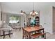 Open-concept living space with dining area, comfortable seating, and sliding glass doors to outdoor area at 15322 Veramonte Way, Orlando, FL 32828