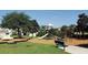 A neighborhood playground with play equipment, including swings, slides, and a seesaw, set on a mulch surface at 15322 Veramonte Way, Orlando, FL 32828