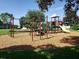 A community playground featuring swings, a slide, and climbing structure in a Gathering-friendly neighborhood at 15322 Veramonte Way, Orlando, FL 32828