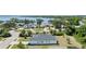 Aerial view of the home showcasing the lush landscaping, well-maintained lawn, and neighborhood at 16211 Oak Breeze Ct, Clermont, FL 34711