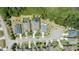 An aerial view of home with pool in a manicured neighborhood at 16211 Oak Breeze Ct, Clermont, FL 34711