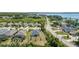 Lovely aerial view of homes in a community with well-maintained lawns and streets on a sunny day at 16211 Oak Breeze Ct, Clermont, FL 34711