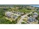 Overhead view showcases a neighborhood's layout, street design, and harmonious integration with the surrounding green spaces at 16211 Oak Breeze Ct, Clermont, FL 34711
