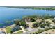 Stunning aerial showcases waterfront homes with private docks, capturing the essence of lakeside living and scenic beauty at 16211 Oak Breeze Ct, Clermont, FL 34711