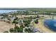 View of a neighborhood nestled alongside a picturesque lake at 16211 Oak Breeze Ct, Clermont, FL 34711