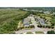 Scenic aerial shot captures the community nestled between lush greenery and wetland, emphasizing the area's natural beauty at 16211 Oak Breeze Ct, Clermont, FL 34711