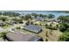 Aerial view of the home showcasing the lush landscaping, well-maintained lawn, and neighborhood at 16211 Oak Breeze Ct, Clermont, FL 34711