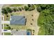 Aerial view of the roof and the lot with some trees at 16211 Oak Breeze Ct, Clermont, FL 34711