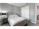 Neutral bedroom with soft lighting, a cozy bed, and ample closet space for a restful retreat at 16211 Oak Breeze Ct, Clermont, FL 34711