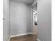 Bright entryway featuring sleek, light-gray walls and contemporary wood-look flooring at 16211 Oak Breeze Ct, Clermont, FL 34711