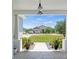 Serene view from the front porch showcases a lush green lawn and a well-maintained neighborhood at 16211 Oak Breeze Ct, Clermont, FL 34711