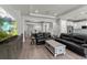 Spacious living room with wood floors, recessed lighting, and an open layout at 16211 Oak Breeze Ct, Clermont, FL 34711