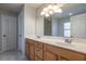 Bathroom featuring double sink vanity, large mirror and decorative lighting at 1663 Markel Dr. Dr, Winter Garden, FL 34787