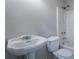 The bathroom includes a classic pedestal sink and a shower with a bathtub at 1663 Markel Dr. Dr, Winter Garden, FL 34787