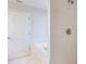 Bathroom featuring bathtub and tiled wall at 1663 Markel Dr. Dr, Winter Garden, FL 34787